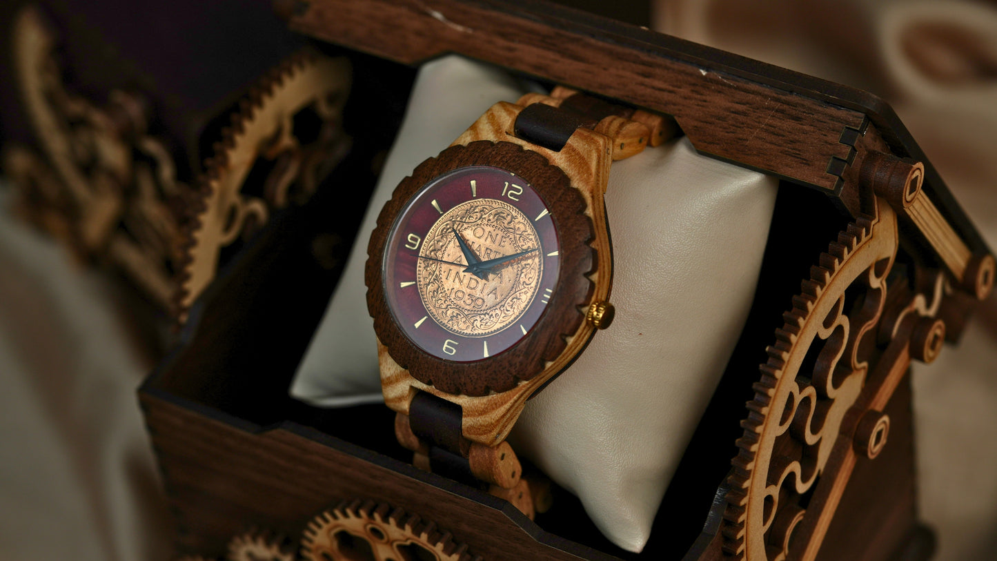 Wooden watch with intricate design on a white cushion inside a wooden box
